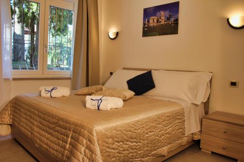 a bedroom with a bed with towels on it at Residence Bellavista in Manerba del Garda