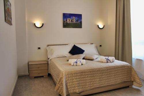 a bedroom with a bed with two pillows on it at Residence Bellavista in Manerba del Garda