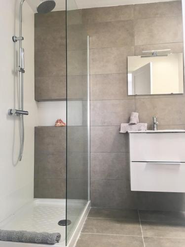 a bathroom with a shower and a sink at Bungalow Alma Playa Roca in Costa Teguise