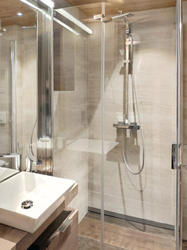 a bathroom with a shower and a sink at Le Chalet des Boisses, Luxury Ski-In Ski-Out Chalet for 12 in Tignes