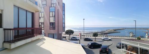 a balcony of a building with a view of the ocean at Apartamento T2 in Vila Praia de Âncora