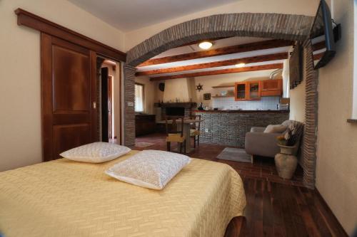 a bedroom with a bed with two pillows on it at Casa Vesna in Rovinj