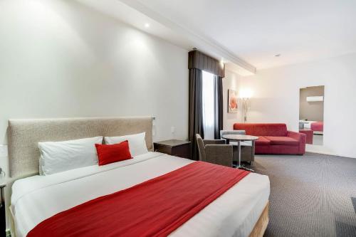 Ένα ή περισσότερα κρεβάτια σε δωμάτιο στο Prince of Wales Hotel