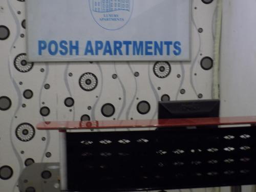 a sign that reads posslash appliances on a wall at Posh Apartments Business Hotel in Ikeja