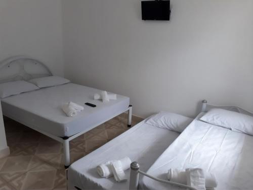 Postel nebo postele na pokoji v ubytování Estúdio em maresias com ar condicionado e piscina