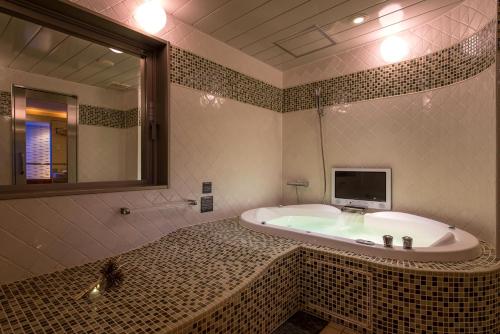Un baño de Hotel C. Chiba Shiroi