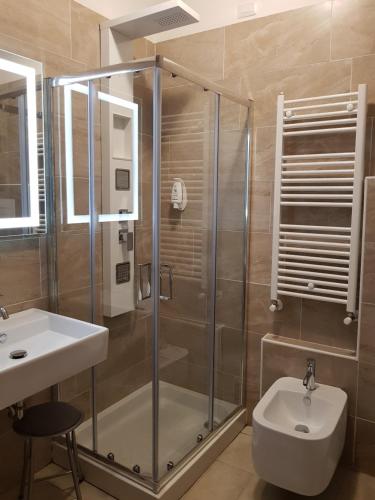 a bathroom with a shower and a sink and a toilet at Valmarina in Calenzano