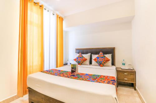 Postel nebo postele na pokoji v ubytování FabHotel Oakwey Inn - Indiranagar