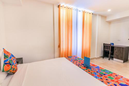 Postel nebo postele na pokoji v ubytování FabHotel Oakwey Inn - Indiranagar
