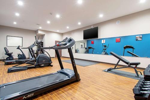 a gym with several exercise bikes in a room at Comfort Suites Humble Houston IAH in Humble