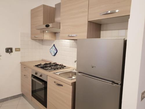 Kuchyň nebo kuchyňský kout v ubytování Terre Apartment