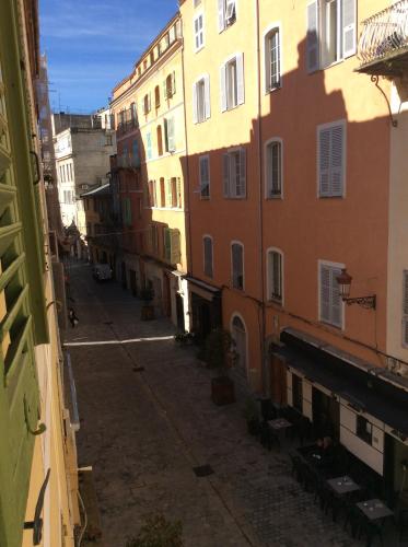 an empty alley in a city with buildings at La Marquise in Bastia