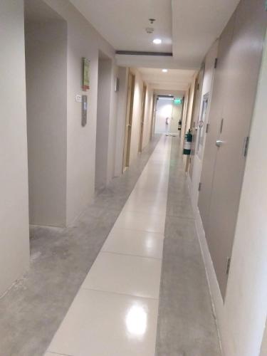 an empty hallway in a building with white walls and floors at Urban Deca Tower Graceysplace Unit unit 3113 Mandaluyong in Manila