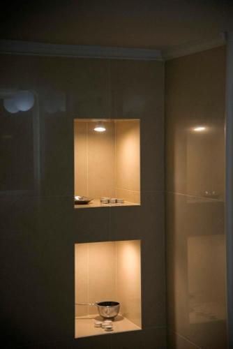 a room with a shelf with a bowl on it at Four Streets Athens - Luxury Suites Apartments in Athens in Athens