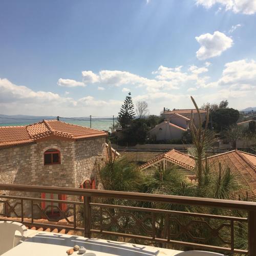 a view from the balcony of a house at Chris Studios & Apartments in Lechaio