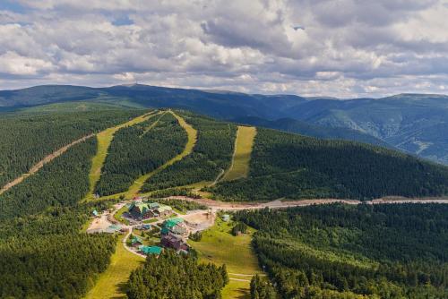 an aerial view of a resort in the middle of a forest at CHALUPA NA VYHLÍDCE in Jeseník
