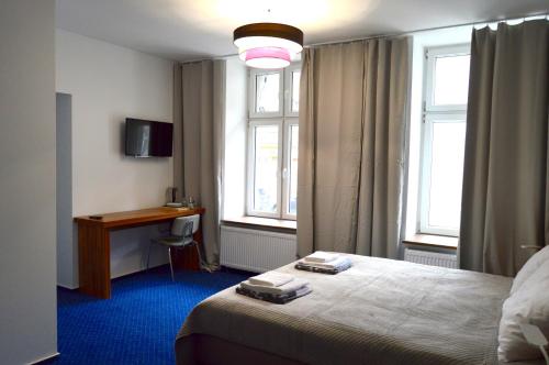Posteľ alebo postele v izbe v ubytovaní Apartamenty Next to Galeria Katowice
