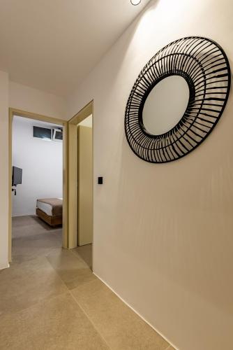 a mirror hanging on a wall in a room at San Giorgio in Fira