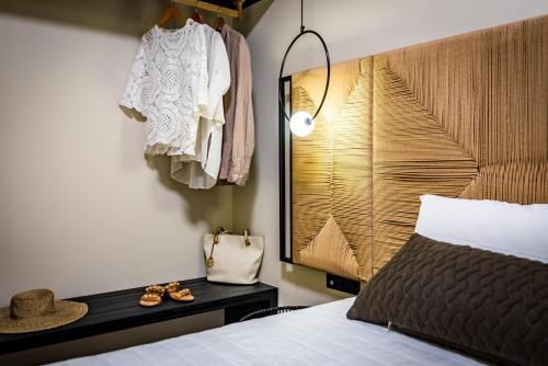 a bedroom with a bed and a wooden head board at San Giorgio in Fira