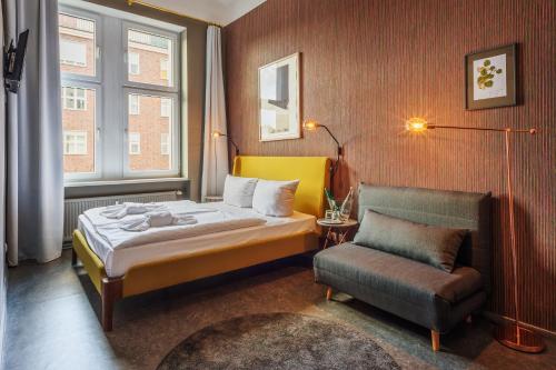 Säng eller sängar i ett rum på Hotel BELLEVUE am Kurfürstendamm