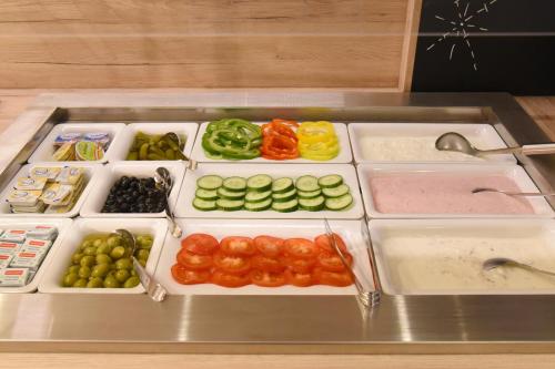 a tray filled with different types of vegetables at Hotel Neutor Express in Salzburg