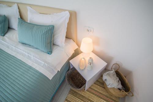 a bedroom with a bed and a table with a lamp at Villa Mamma Mia Oprtalj in Oprtalj