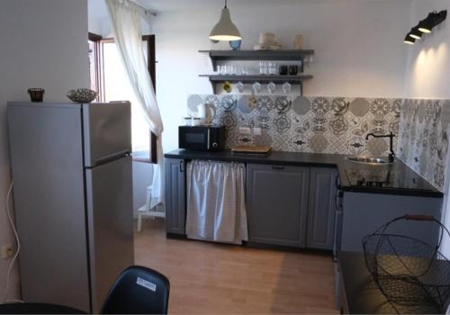 Kuchyň nebo kuchyňský kout v ubytování Apartments Jelena