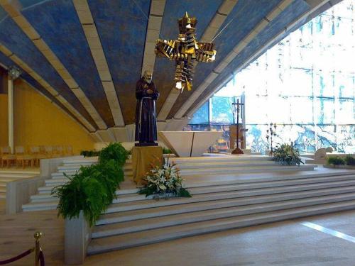 a church with a statue in the middle of a row of stairs at Albergo Villa Marchese in San Giovanni Rotondo