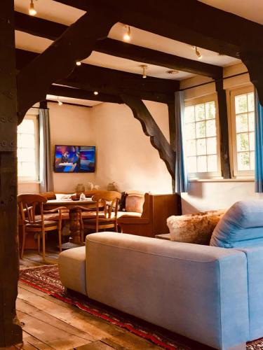 a living room with a couch and a table at Das Mühlchen in Ladbergen