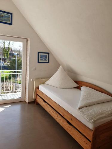 Un pat sau paturi într-o cameră la Elbe Ferien