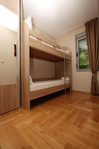 a room with two bunk beds in it at The Old Town Terrace Apartments in Budva