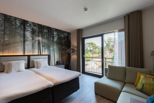 מיטה או מיטות בחדר ב-Fletcher Hotel-Restaurant Jagershorst-Eindhoven