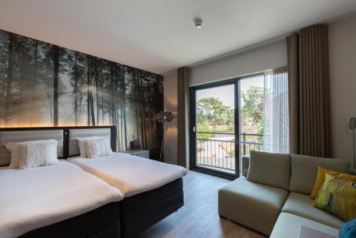 Postel nebo postele na pokoji v ubytování Fletcher Hotel-Restaurant Jagershorst-Eindhoven