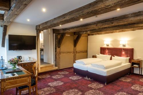 Säng eller sängar i ett rum på Romantik Hotel Alte Münze