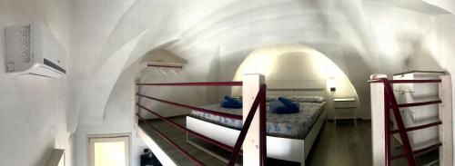 a room with two bunk beds in a building at Villetta Natalia 2 in Torre Colimena