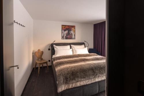 מיטה או מיטות בחדר ב-Luxus Chalet Quellhaus