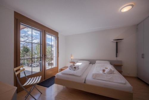 Postel nebo postele na pokoji v ubytování Chalet Alpenrebe