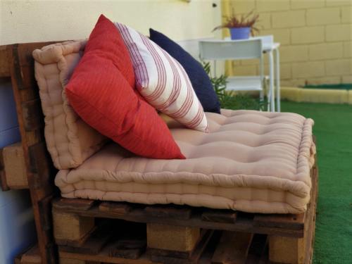 two pillows are sitting on top of a bed at Sleeping Sarria in Sarria
