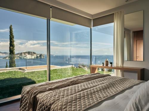 Ένα ή περισσότερα κρεβάτια σε δωμάτιο στο Alkyonides Villas