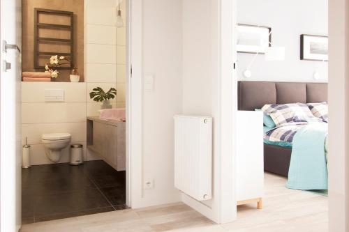 Postel nebo postele na pokoji v ubytování Flaming Rentyear Apartments
