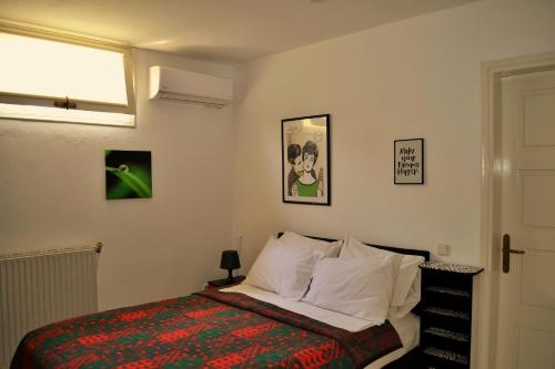 a bedroom with a bed and a window at Seaside View Villa in Hanioti