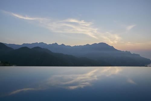 a view of a lake with mountains in the background at Caruso, A Belmond Hotel, Amalfi Coast in Ravello