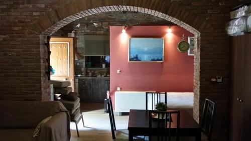 a living room with a red wall at Pacithea Villas in Miléai