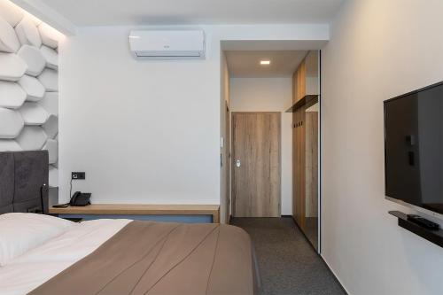 TV a/nebo společenská místnost v ubytování 4 SMART HOTEL