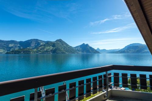 a view of a lake from a balcony at Superior Hotel Nidwaldnerhof in Beckenried