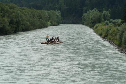 a group of people on a boat on a river at Restaurant - Café - Pension HASSLER in Berg im Drautal