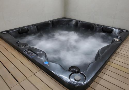 a bath tub filled with clouds in a room at Monte Vedetta in Sliven
