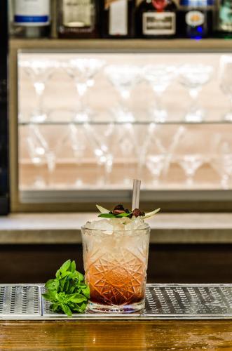 a drink sitting on top of a table at Pela Mare Hotel in Agia Pelagia