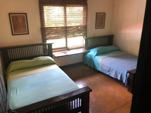 A bed or beds in a room at Finca Panaca Jaguey 5