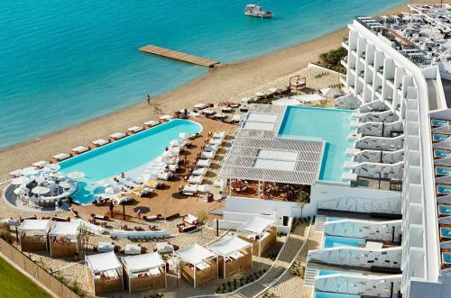 an aerial view of a resort with a beach at Nikki Beach Resort & Spa Porto Heli in Porto Heli